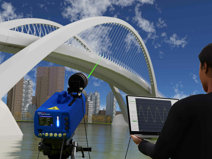 Single-point Laser Doppler Vibrometer performing vibration measurement on a bridge structure; a person monitors the measurement data on a laptop.